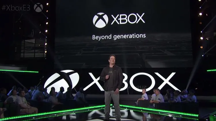 xbox logo with guy on stage making a speech